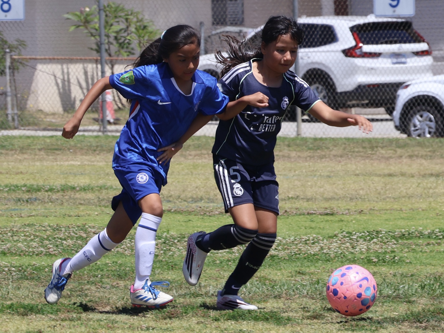 Alhambra FC players competing for the ball